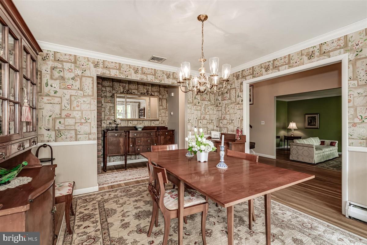 396 Riverside Drive Princeton, NJ 08540 - Photo 6 of 39 a view of a dining room with furniture and chandelier