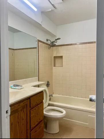 a view of an empty room and a window