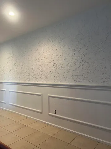 a view of a closet and wooden floor