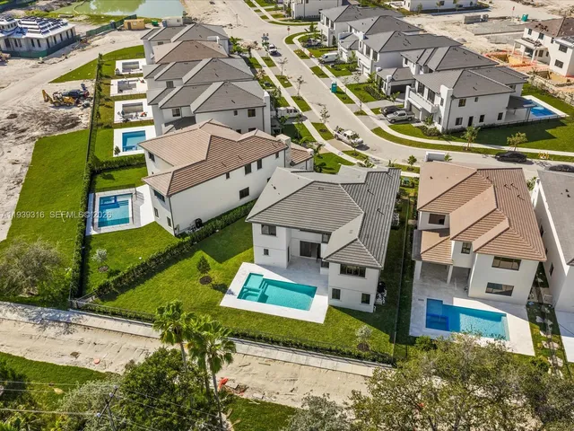 an aerial view of a house with a garden