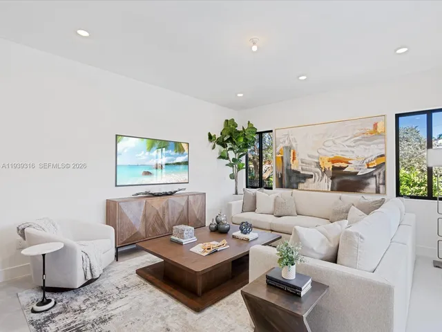 a bathroom with a double vanity sink a mirror and a bathtub