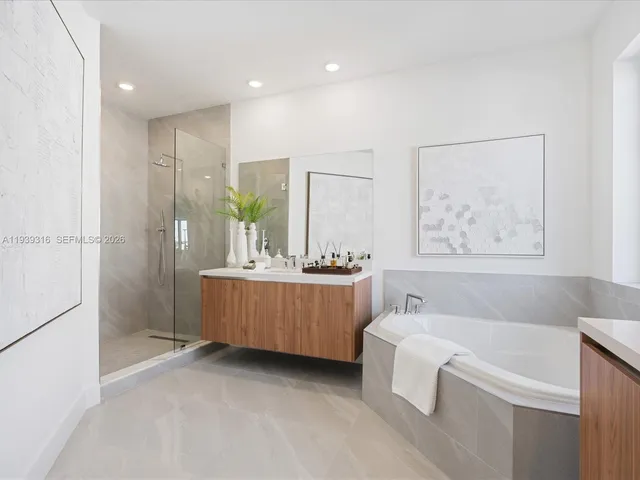 a view of a big room with wooden cabinets and table