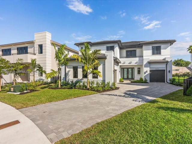 a kitchen with a sink a stove and cabinets