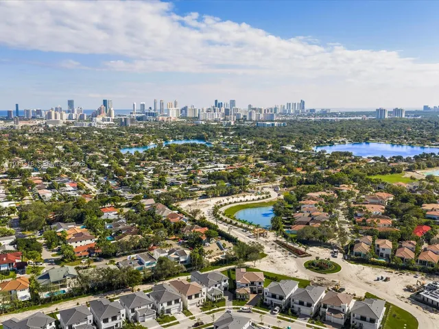 a front view of a house with a yard and mountain view