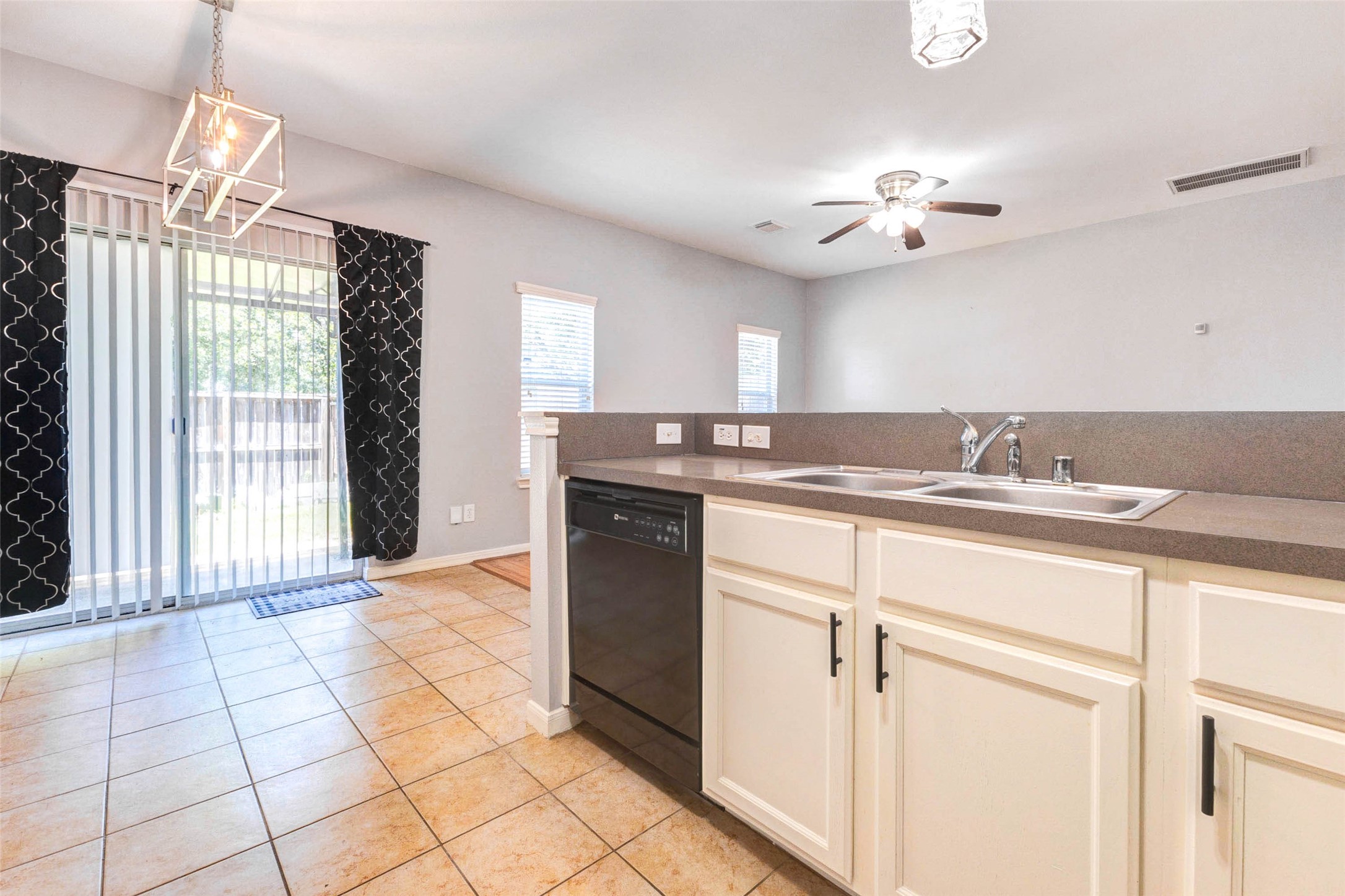 14522 Durham Chase Lane Houston, TX 77095 - Photo 13 of 40 a kitchen with stainless steel appliances granite countertop a sink a counter space and a window