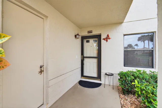 a view of front door and bedroom