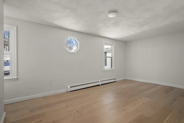 an empty room with a empty space and a window