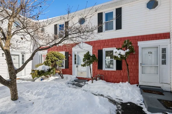 a view of a street with a building in the background