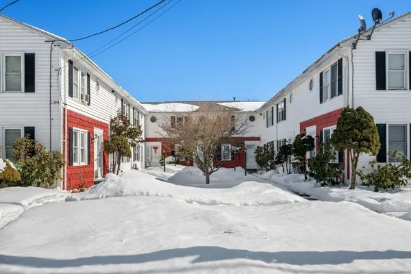 a view of backyard of house with outdoor seating