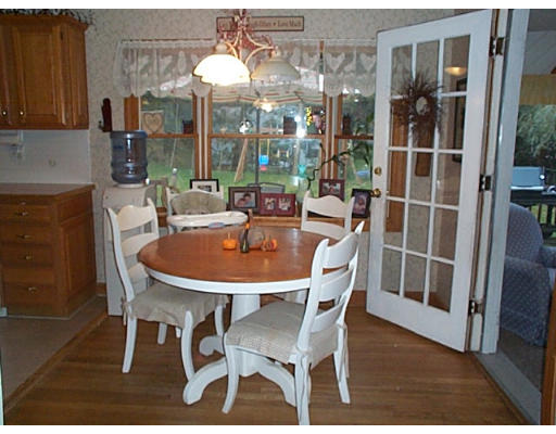 40 Davidson Road Framingham, MA 01701 - Photo 3 of 20 a dining room with furniture a chandelier and wooden floor