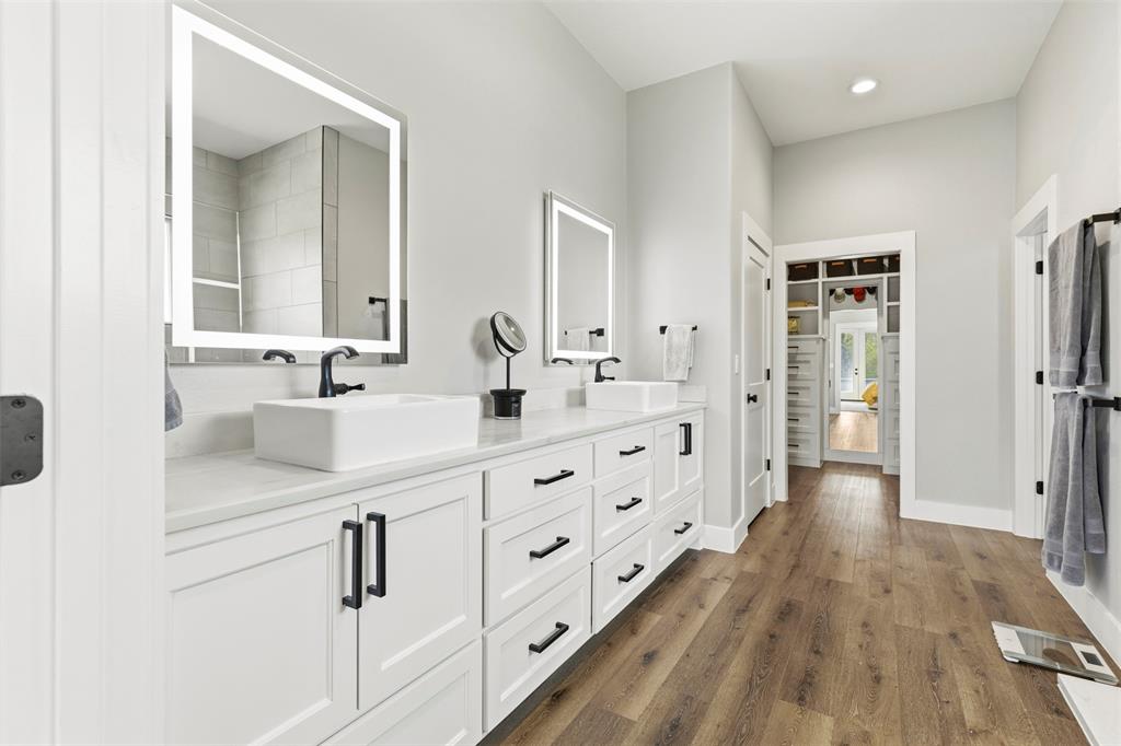 108 Golf Walk Circle Denison, TX 75020 - Photo 19 of 40 a spacious bathroom with double vanity sink and a mirror
