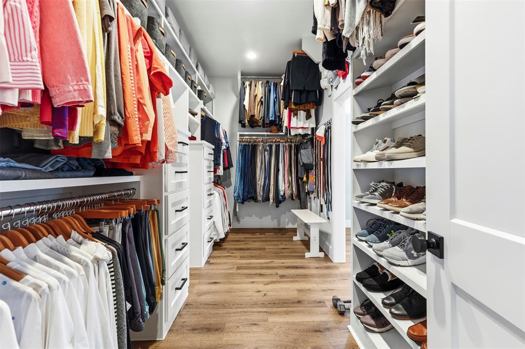 108 Golf Walk Circle Denison, TX 75020 - Photo 21 of 40 a view of walk in closet with clothes and shoes