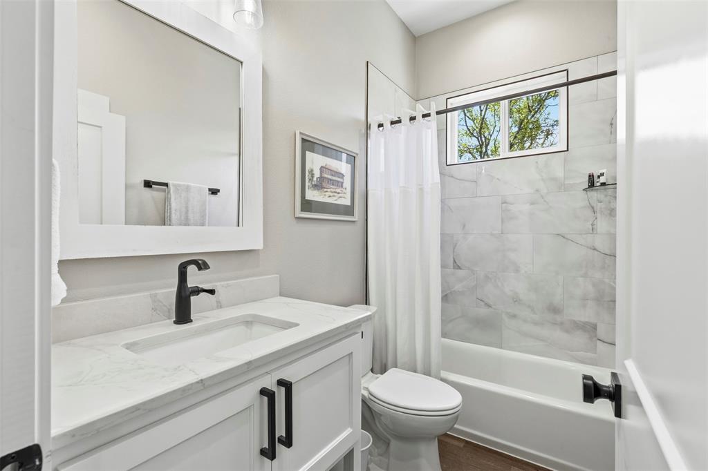 108 Golf Walk Circle Denison, TX 75020 - Photo 28 of 40 a bathroom with a sink a toilet and shower