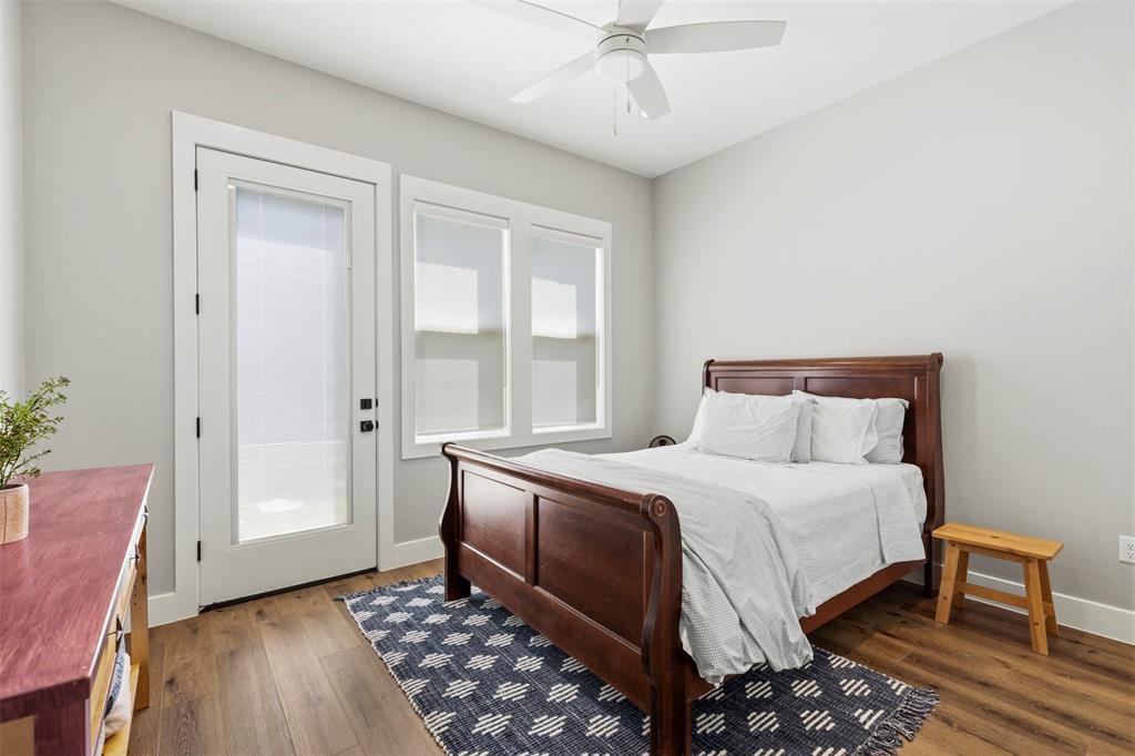 108 Golf Walk Circle Denison, TX 75020 - Photo 29 of 40 a bedroom with a bed and a window