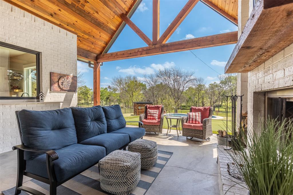 108 Golf Walk Circle Denison, TX 75020 - Photo 35 of 40 a roof deck with a table and chairs