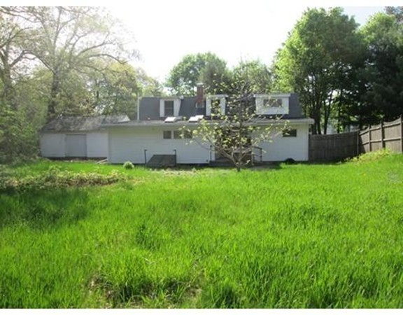 9 Birch Road Natick, MA 01760 - Photo 3 of 10 a view of a house with a yard and sitting area