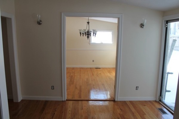 9 Birch Road Natick, MA 01760 - Photo 10 of 10 an empty room with wooden floor and windows