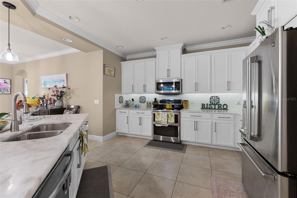 1208 Fieldstone Circle Oviedo, FL 32765 - Photo 11 of 43 a kitchen with a sink appliances and cabinets