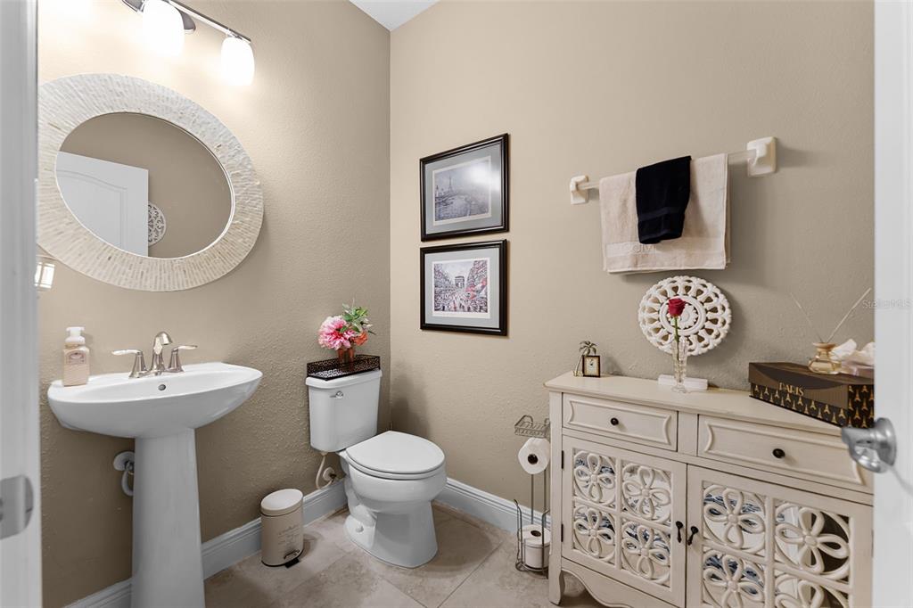 1208 Fieldstone Circle Oviedo, FL 32765 - Photo 15 of 43 a bathroom with a toilet sink and mirror