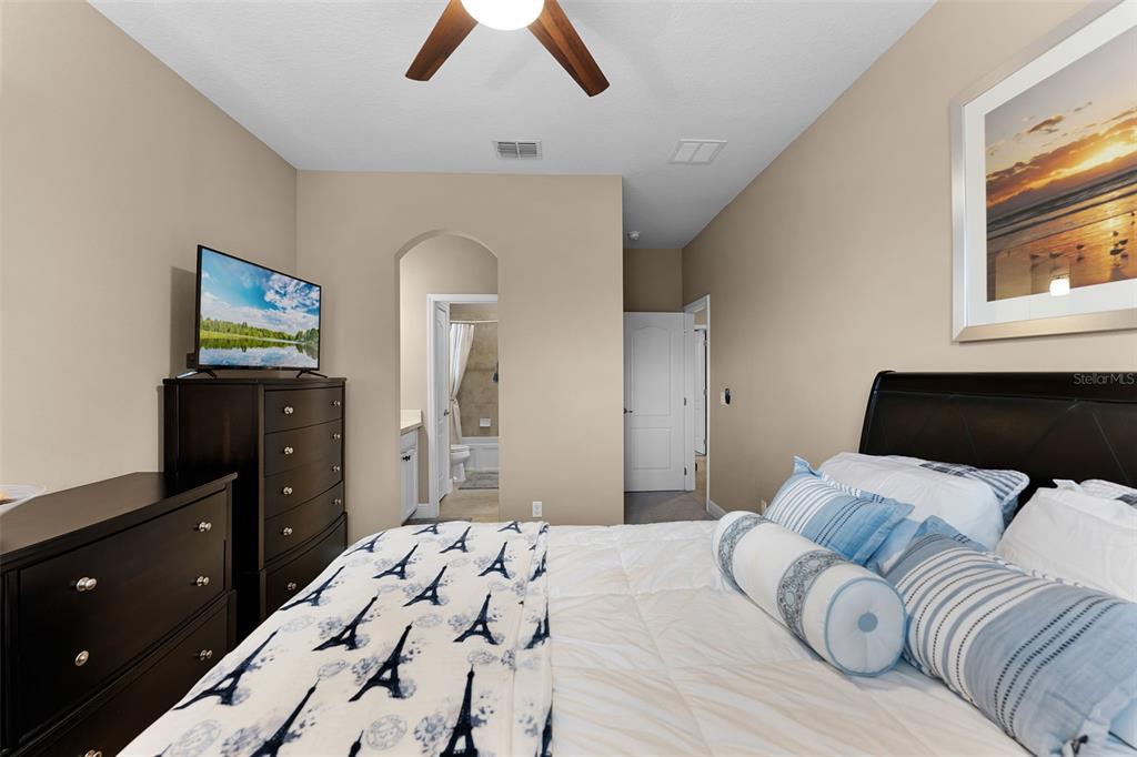 1208 Fieldstone Circle Oviedo, FL 32765 - Photo 17 of 43 a bedroom with a bed and a dresser