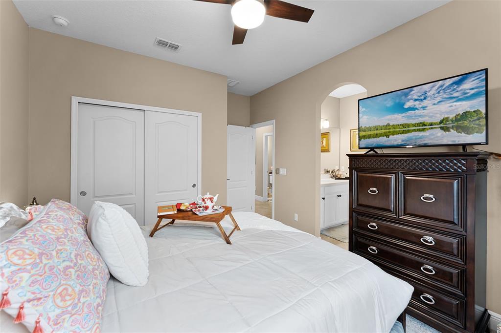 1208 Fieldstone Circle Oviedo, FL 32765 - Photo 21 of 43 a bedroom with a bed and furniture