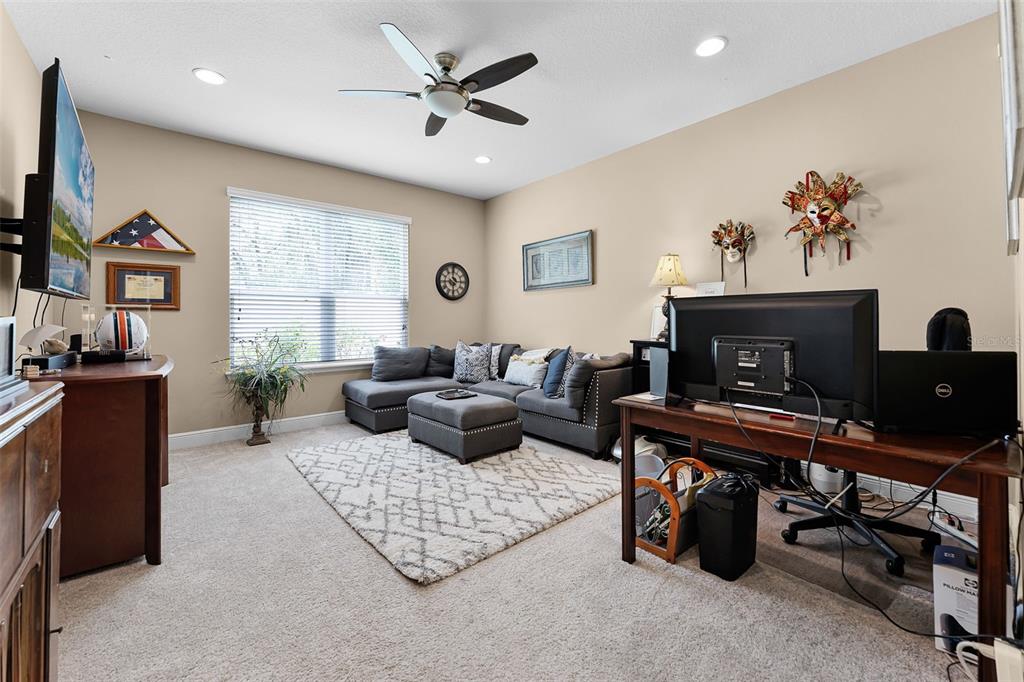 1208 Fieldstone Circle Oviedo, FL 32765 - Photo 31 of 43 a living room with furniture rug and window