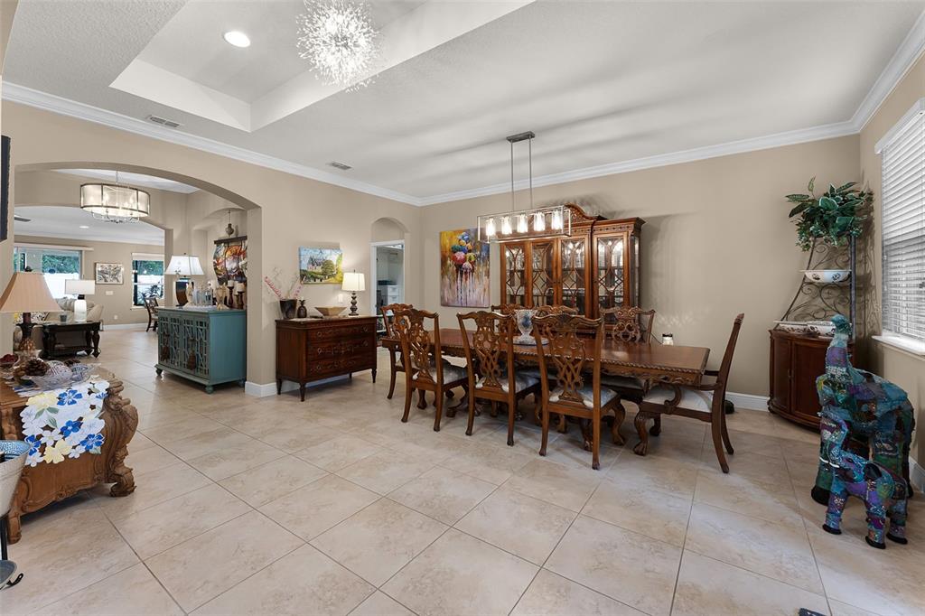 1208 Fieldstone Circle Oviedo, FL 32765 - Photo 6 of 43 a view of a dining room with furniture and chandelier