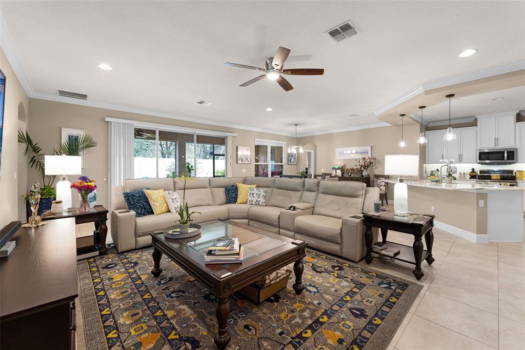 1208 Fieldstone Circle Oviedo, FL 32765 - Photo 7 of 43 a living room with lots of furniture and view of kitchen