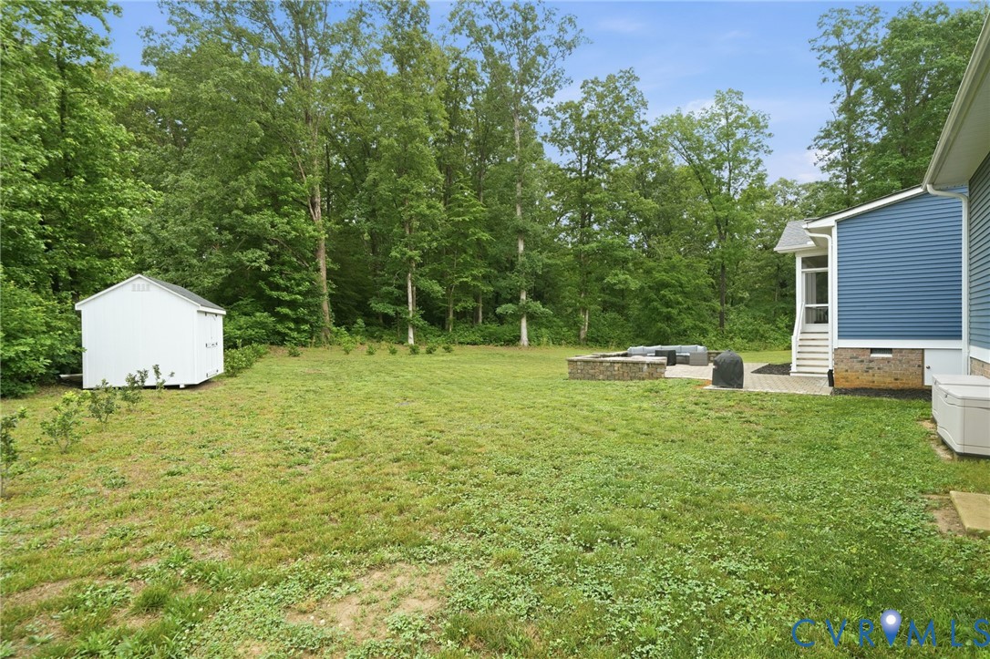 7598 Rural Point Road Mechanicsville, VA 23116 - Photo 36 of 41 a backyard of a house with lots of green space