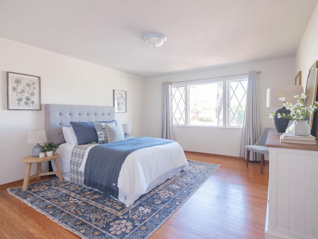 264 Upland Road Redwood City, CA 94062 - Photo 11 of 31 a living room with a couch and wooden floor