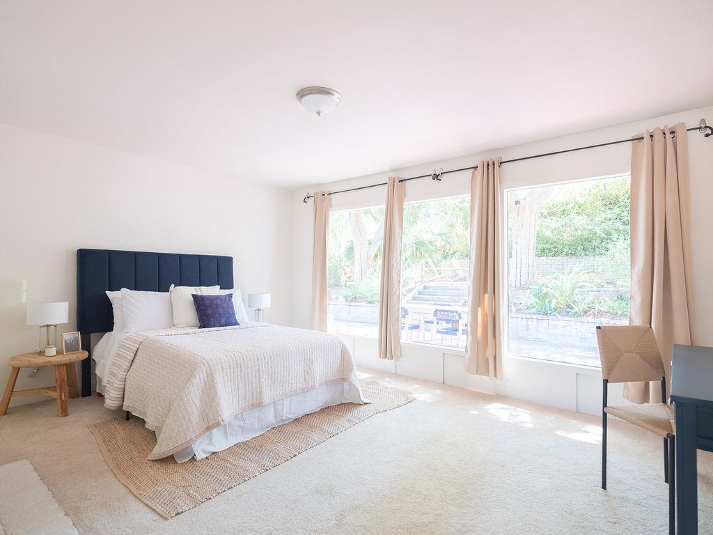 264 Upland Road Redwood City, CA 94062 - Photo 14 of 31 a bedroom with a large bed and a large window