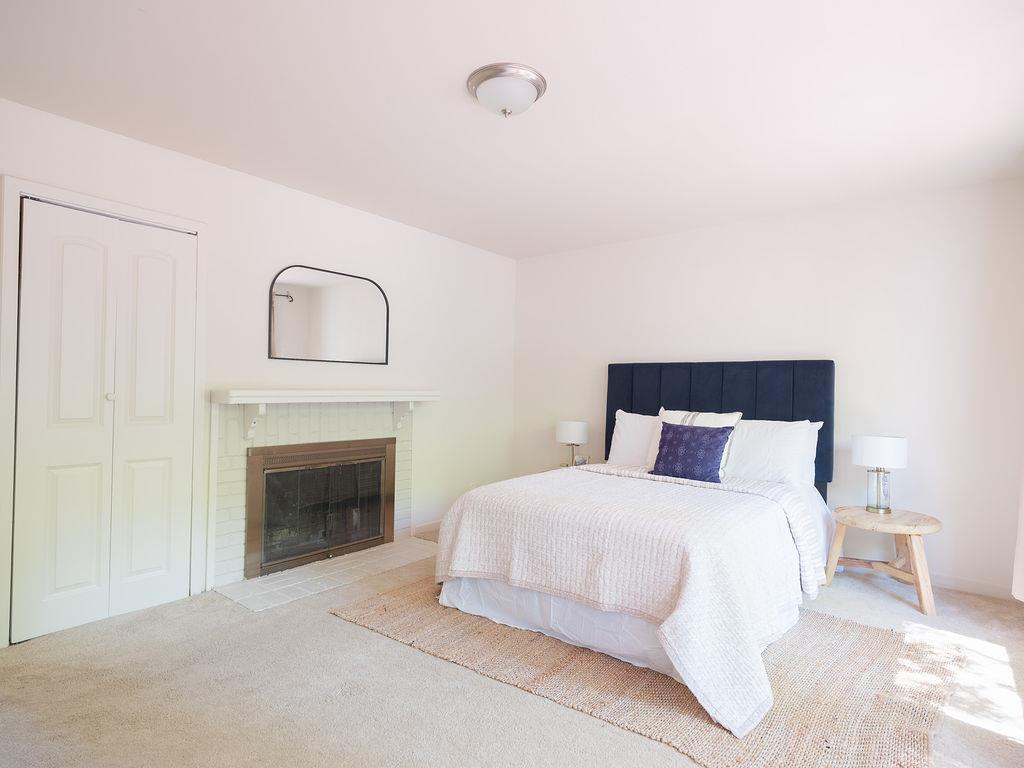 264 Upland Road Redwood City, CA 94062 - Photo 15 of 31 a large white bed with a fireplace
