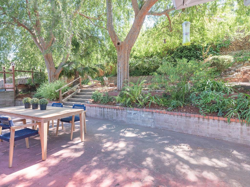 264 Upland Road Redwood City, CA 94062 - Photo 21 of 31 a view of backyard with a table and chairs