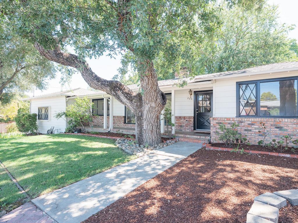 264 Upland Road Redwood City, CA 94062 - Photo 27 of 31 a front view of a house with a garden and yard