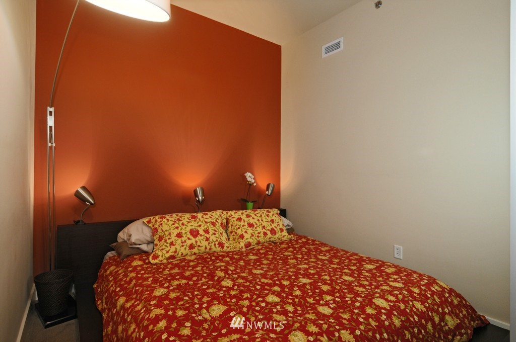 737 Olive Way, Unit 2809 Seattle, WA 98101 - Photo 11 of 24 a bedroom with a bed