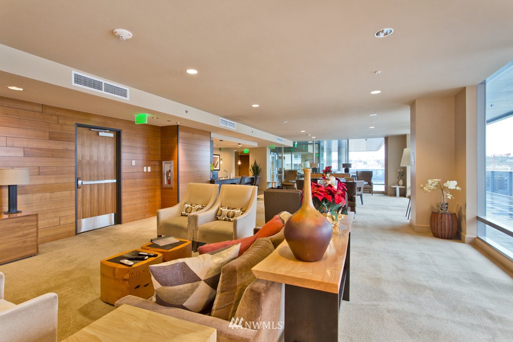 737 Olive Way, Unit 2809 Seattle, WA 98101 - Photo 20 of 24 a living room with furniture and a large window