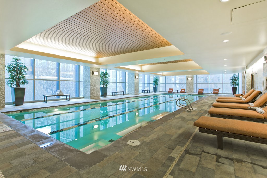 737 Olive Way, Unit 2809 Seattle, WA 98101 - Photo 23 of 24 a view of a patio with swimming pool table and chairs