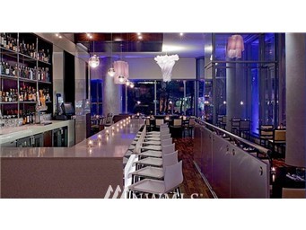 737 Olive Way, Unit 2809 Seattle, WA 98101 - Photo 24 of 24 a black and white photo of a living room