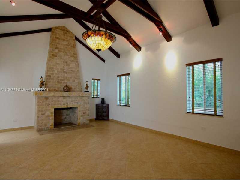 7975 Sunset Drive Miami, FL 33143 - Photo 4 of 21 wooden floor in an empty room with a fireplace