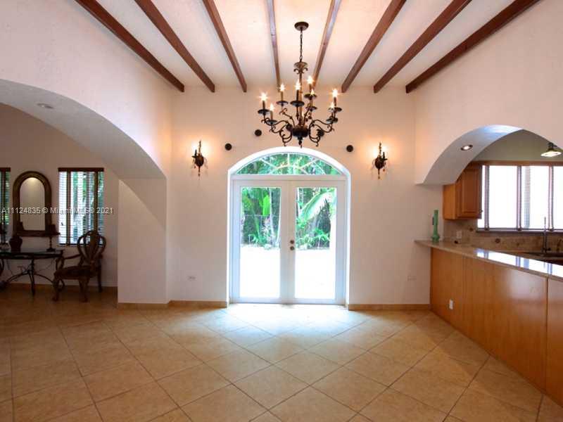 7975 Sunset Drive Miami, FL 33143 - Photo 5 of 21 a view of a livingroom with a chandelier furniture and window