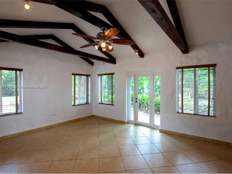 7975 Sunset Drive Miami, FL 33143 - Photo 8 of 21 a view of an empty room with a window