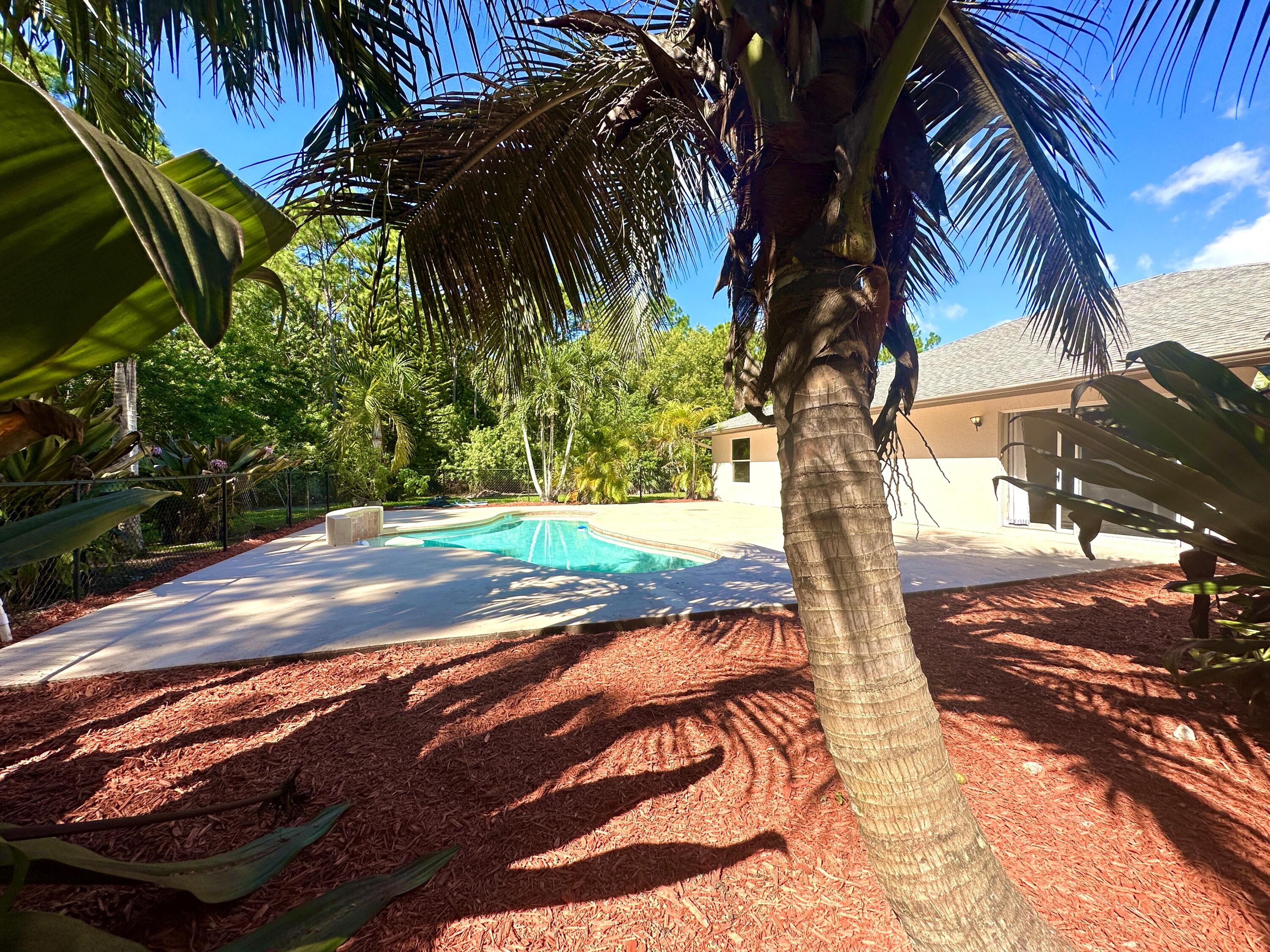 13338 76th Road North West Palm Beach, FL 33412 - Photo 12 of 138 a view of a yard with plants