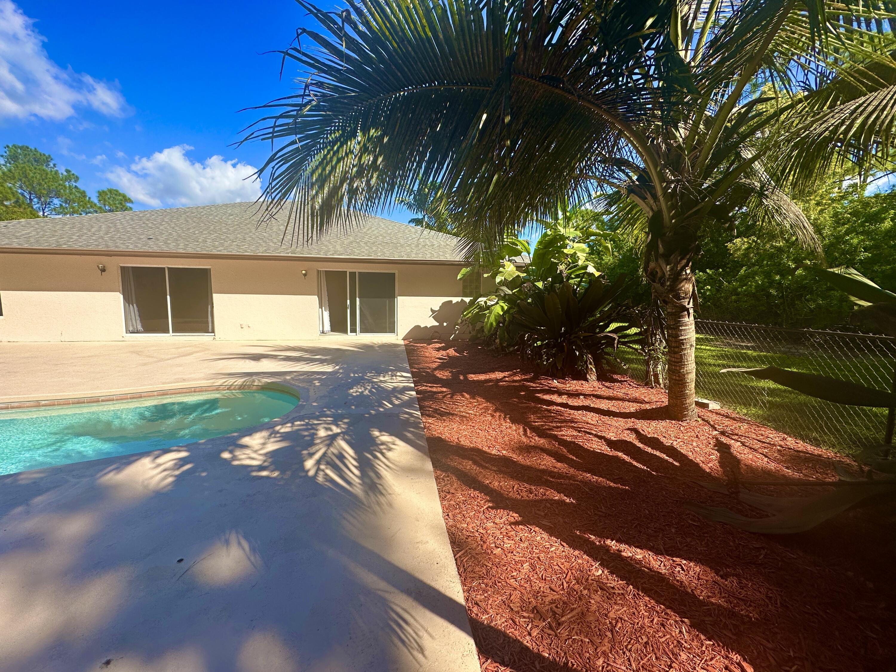13338 76th Road North West Palm Beach, FL 33412 - Photo 136 of 138 a front view of a house with yard