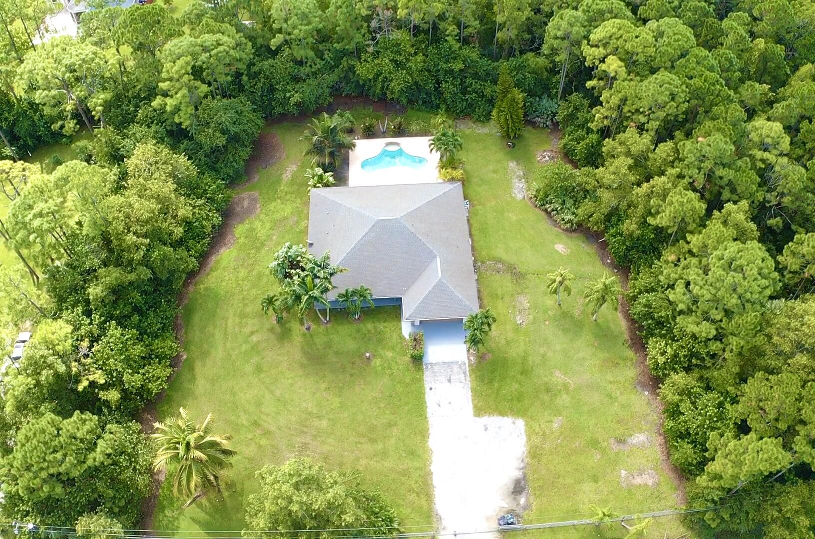 13338 76th Road North West Palm Beach, FL 33412 - Photo 17 of 138 an aerial view of residential houses with yard