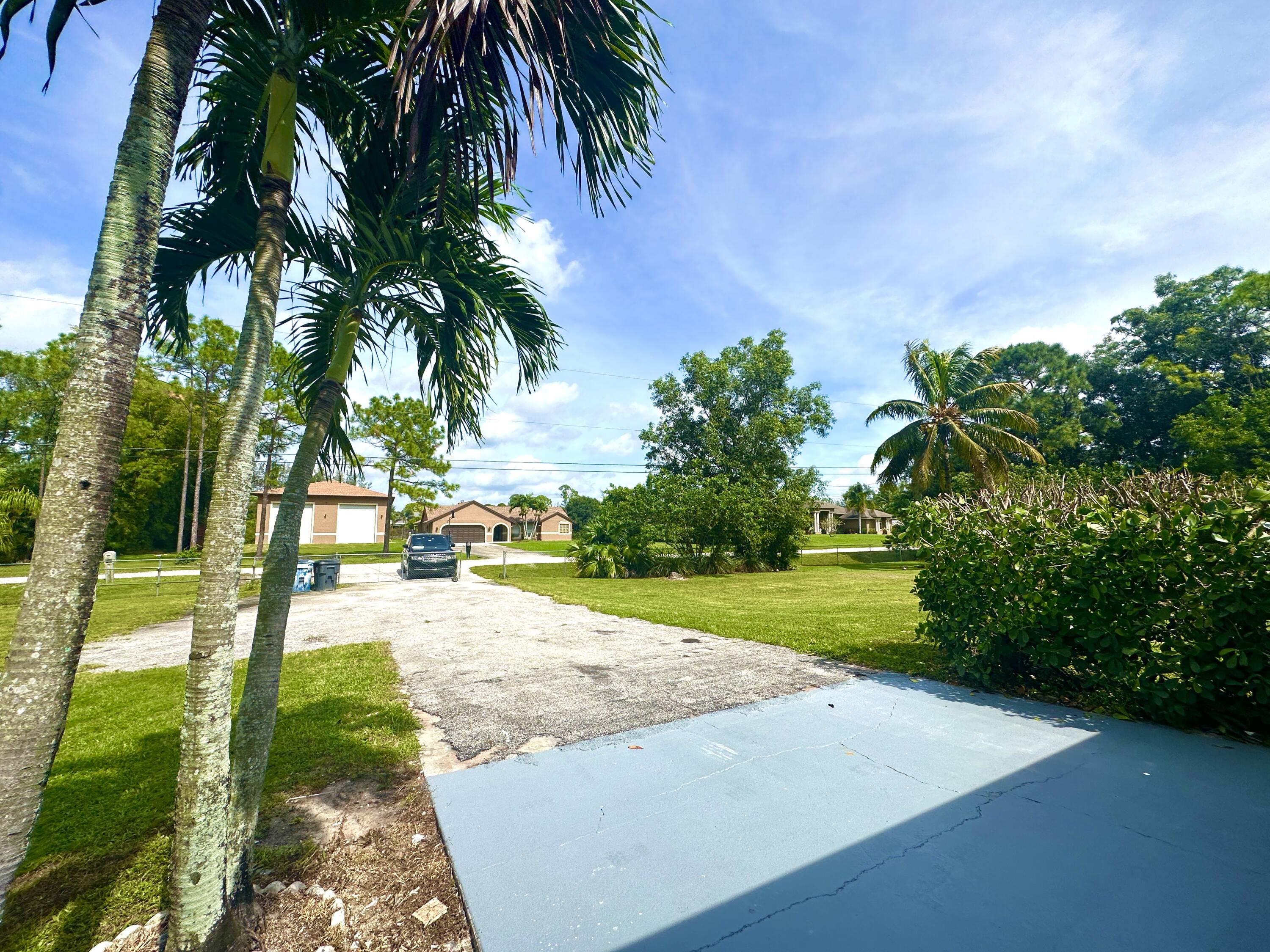 13338 76th Road North West Palm Beach, FL 33412 - Photo 33 of 138 a view of a yard and entertaining space