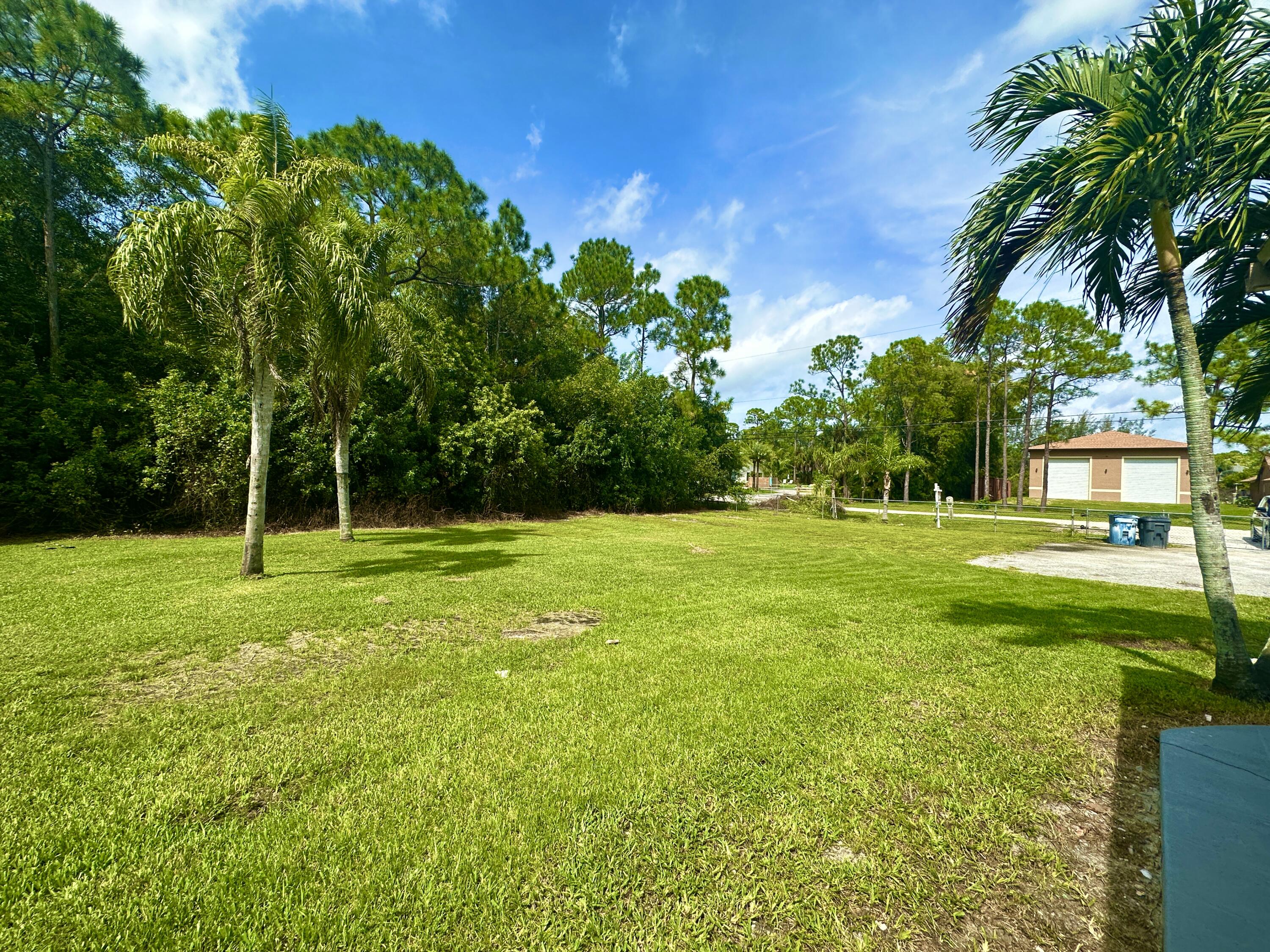 13338 76th Road North West Palm Beach, FL 33412 - Photo 35 of 138 a view of a park with a tree in the background