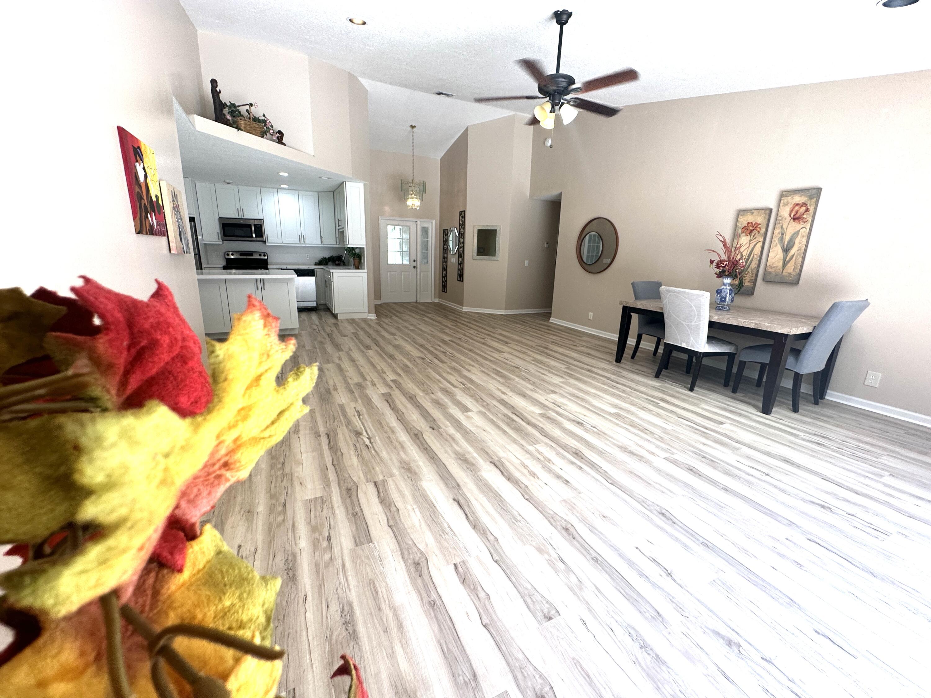 13338 76th Road North West Palm Beach, FL 33412 - Photo 36 of 138 a living room with furniture and a chandelier
