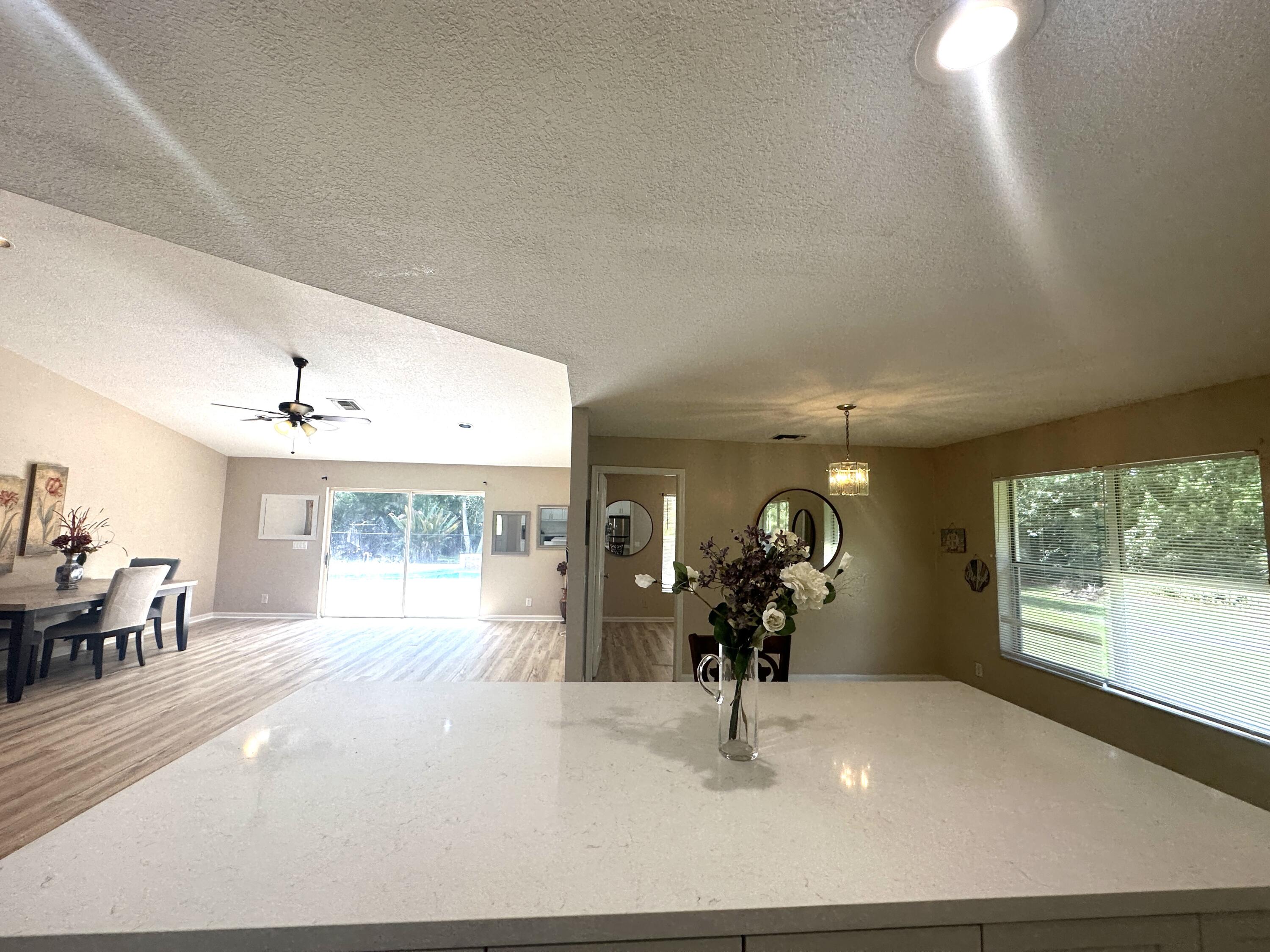 13338 76th Road North West Palm Beach, FL 33412 - Photo 42 of 138 a view of a living room and window