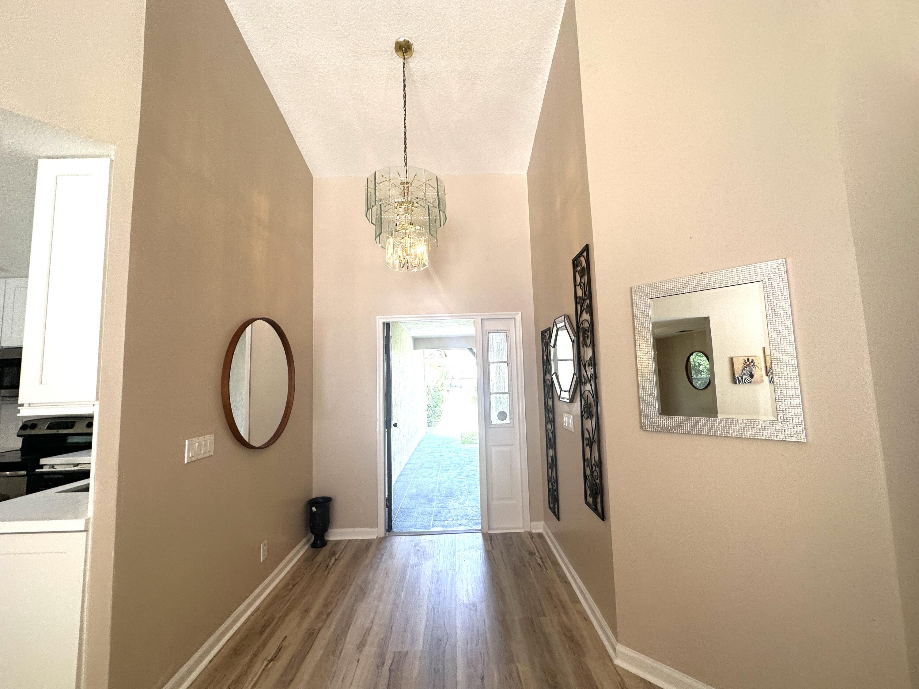 13338 76th Road North West Palm Beach, FL 33412 - Photo 63 of 138 a view of a room with wooden floor and windows