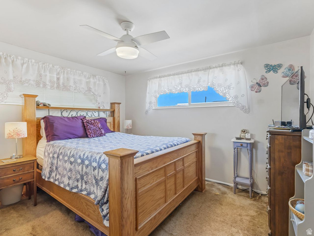 1502 North 475 West Sunset, UT 84015 - Photo 13 of 23 Bedroom featuring light-toned walls, a white ceiling fan with integrated lighting, two windows with horizontal blinds, and carpeting